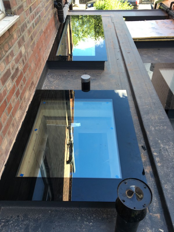 Multiple flat roof skylights on extension in London